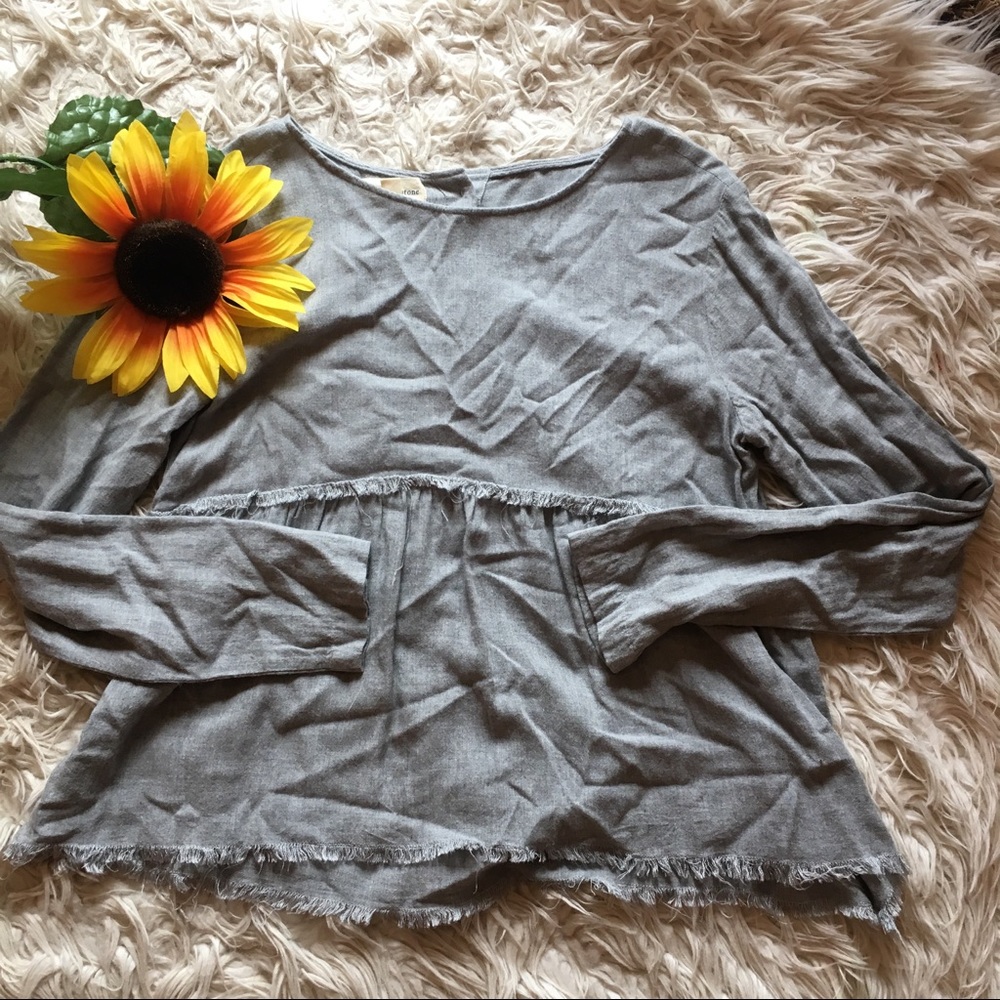 Anthropologie gray fringe hem button back blouse